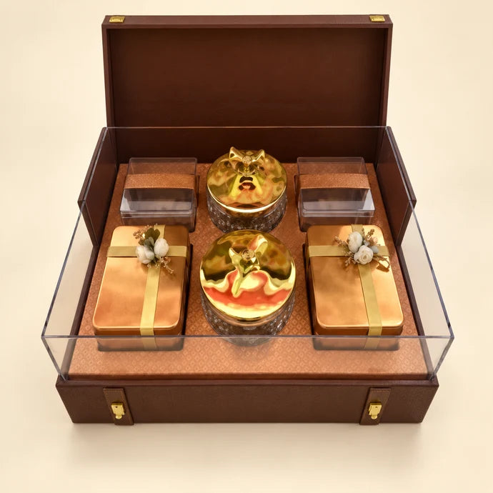 MM Mithaiwala Brown Presentation Box with a textured brown lid, golden trim and transparent side panels.
