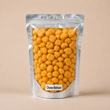 MM Mithaiwala Cheese Makhana in a silver resealable pouch showing golden-yellow makhana through its clear front.