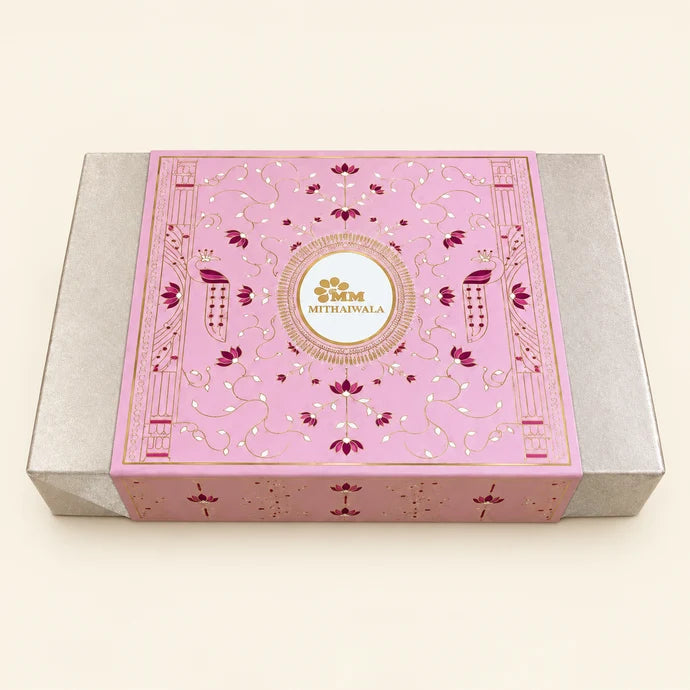 MM Mithaiwala Floral Gift Box, a closed pink and silver gift box with floral patterns and a central brand label.