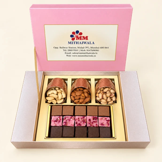 MM Mithaiwala Floral Gift Box, a closed pink and silver gift box with floral patterns and a central brand label.