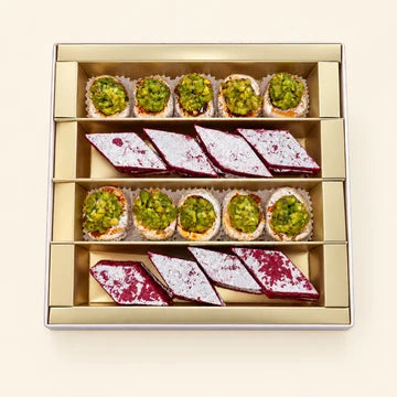 MM Mithaiwala Gulkand Bahar Box with green nut-filled sweets and red-and-white silver-leaf mithai.