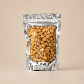 MM Mithaiwala Lime Chilli Makhana in a silver pouch showing seasoned makhana through its clear front.