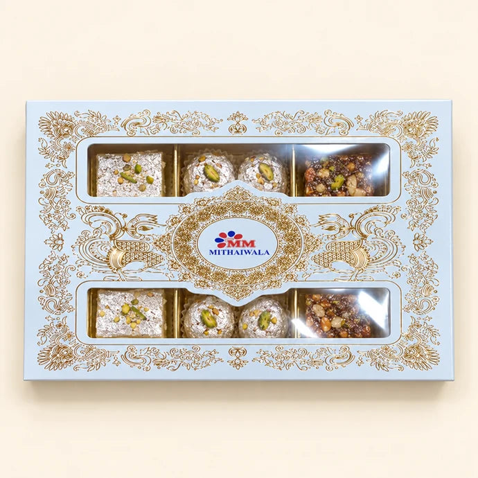 MM Mithaiwala MM Fancy Box 1/4 Kg with ornate golden patterns and two windows showing assorted sweets.