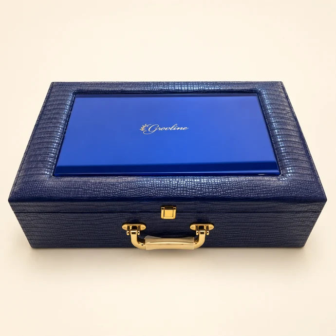 MM Mithaiwala Navy Blue Presentation Chest, a closed textured navy gift case with a blue lid panel and golden handle.