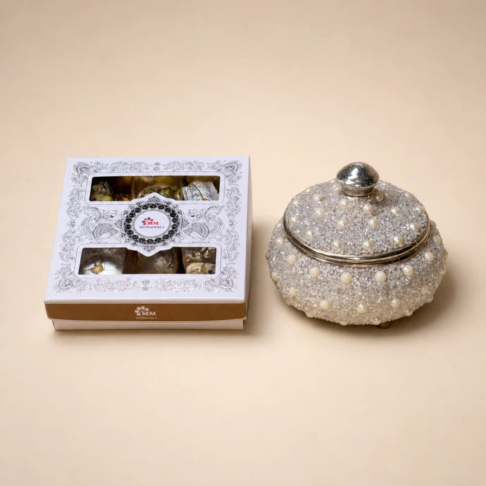 MM Mithaiwala Nazrana mithai box with white and gold packaging and two windows displaying assorted sweets.