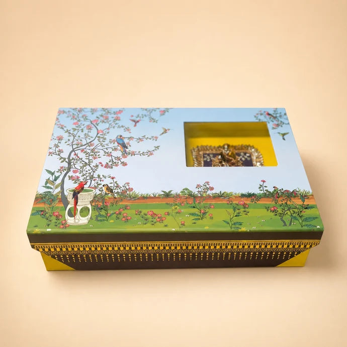 MM Mithaiwala Ornate Sky-Blue Gift Box with a garden illustration, decorative borders and a square window.