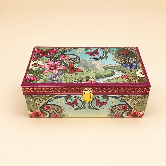 MM Mithaiwala Secret Garden Twin Box, a closed floral gift chest with a garden illustration and golden clasp.
