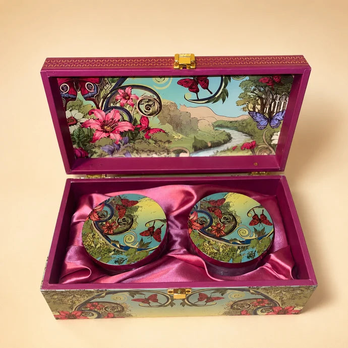 MM Mithaiwala Secret Garden Twin Box, a closed floral gift chest with a garden illustration and golden clasp.