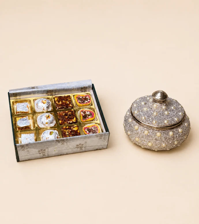 MM Mithaiwala The Forest Box 12 Cavity, a closed dark green gift box with botanical patterns and a central brand label.