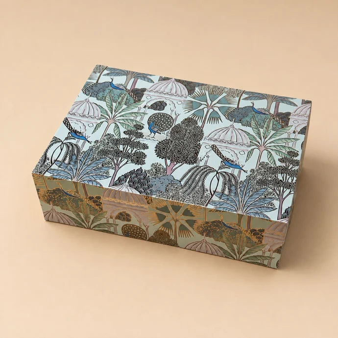 MM Mithaiwala Wild Elegance, a closed gift box with botanical patterns and wildlife illustrations.